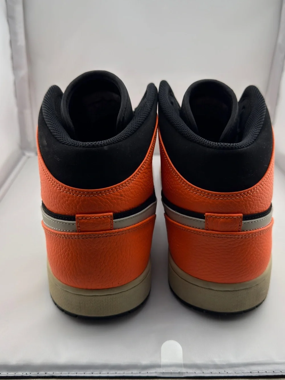Jordan Black and Orange Mid-Top Sneakers with Cream Swoosh